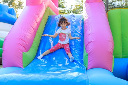 Kid on inflatable slide